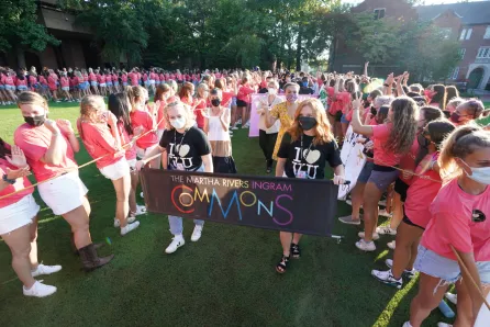 Students cheer during the Founders Walk procession.