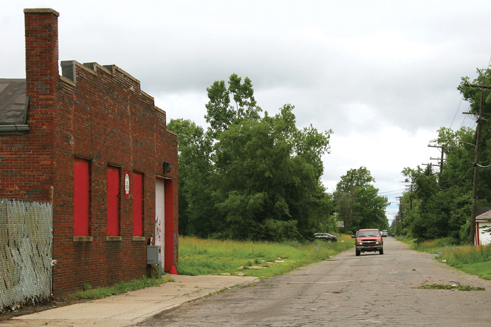 photo of boarded-up building in a small town in decline