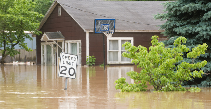 Floodwaters coming halfway up the side of a house
