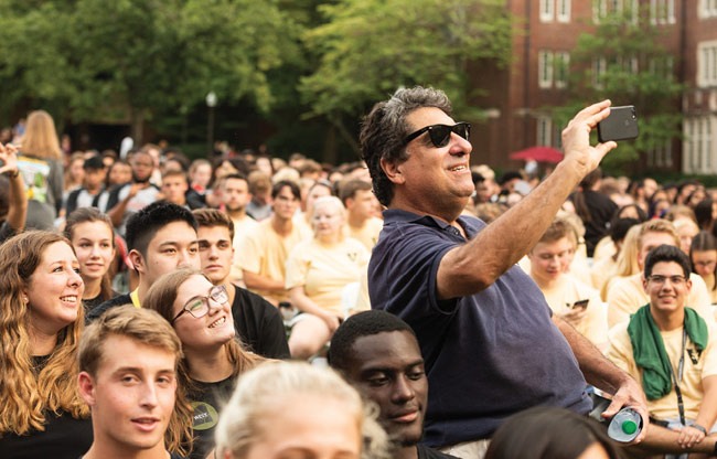 Chancellor Nicholas S. Zeppos poses for selfies with students at Founders Walk. (Vanderbilt University)