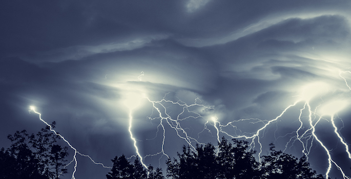 storming night with many bolts of lightning