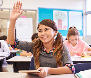 Girl smiling and raising hand