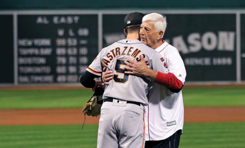 photo of Mike and Carl Yastrzemski embracing on the field
