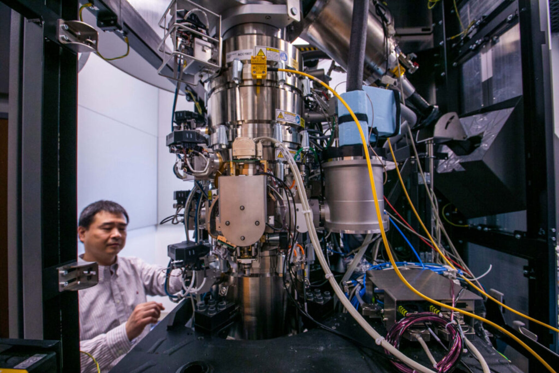 Image of staff next to equipment