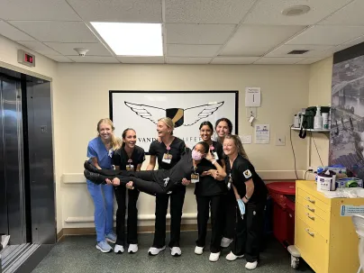 Anana Upton gets a "helping hand" from her fellow Vanderbilt University School of Nursing students.