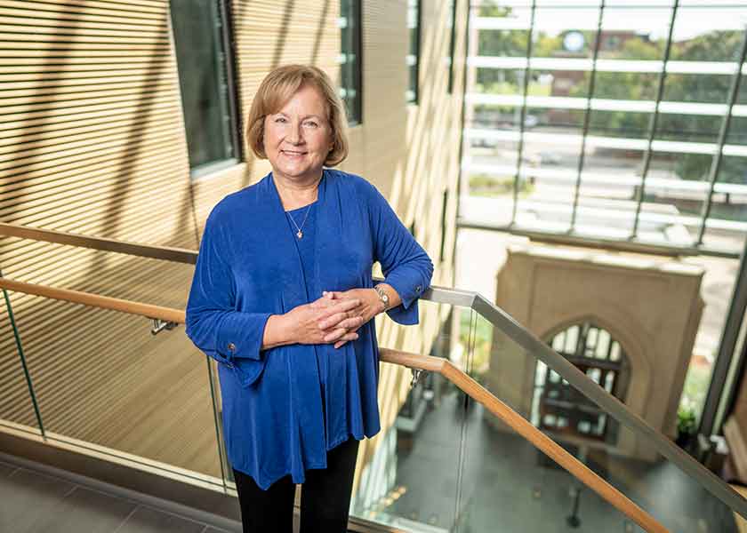 Professor Julie Barroso on a landing in VUSN's atrium
