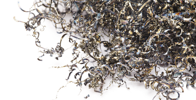 Metal shavings on white background.