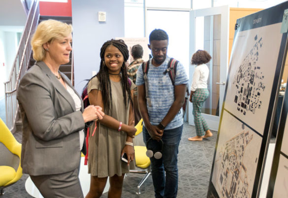 Provost and Vice Chancellor for Academic Affairs Susan R. Wente (left) and students at the FutureVU Expo April 19. (Joe Howell/Vanderbilt)