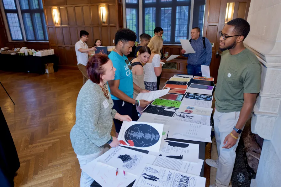 JJ Johnson (right) showcases his Immersion Vanderbilt project to the Vanderbilt community at the 2023 Undergraduate Creative Writing Symposium and Art Showcase on April 13, 2023. (Vanderbilt University)