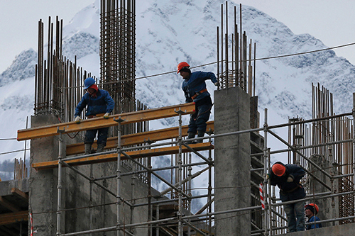 photo of workers constructing a building in Sochi, Russia