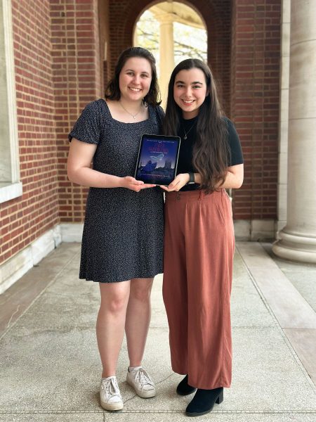 Elizabeth Seeker and Marissa Tessier stand under the arches of Peabody's Wyatt Center.