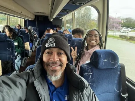 Reginald Archer with Vanderbilt and TSU students on bus tour.