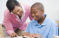 teacher helping student