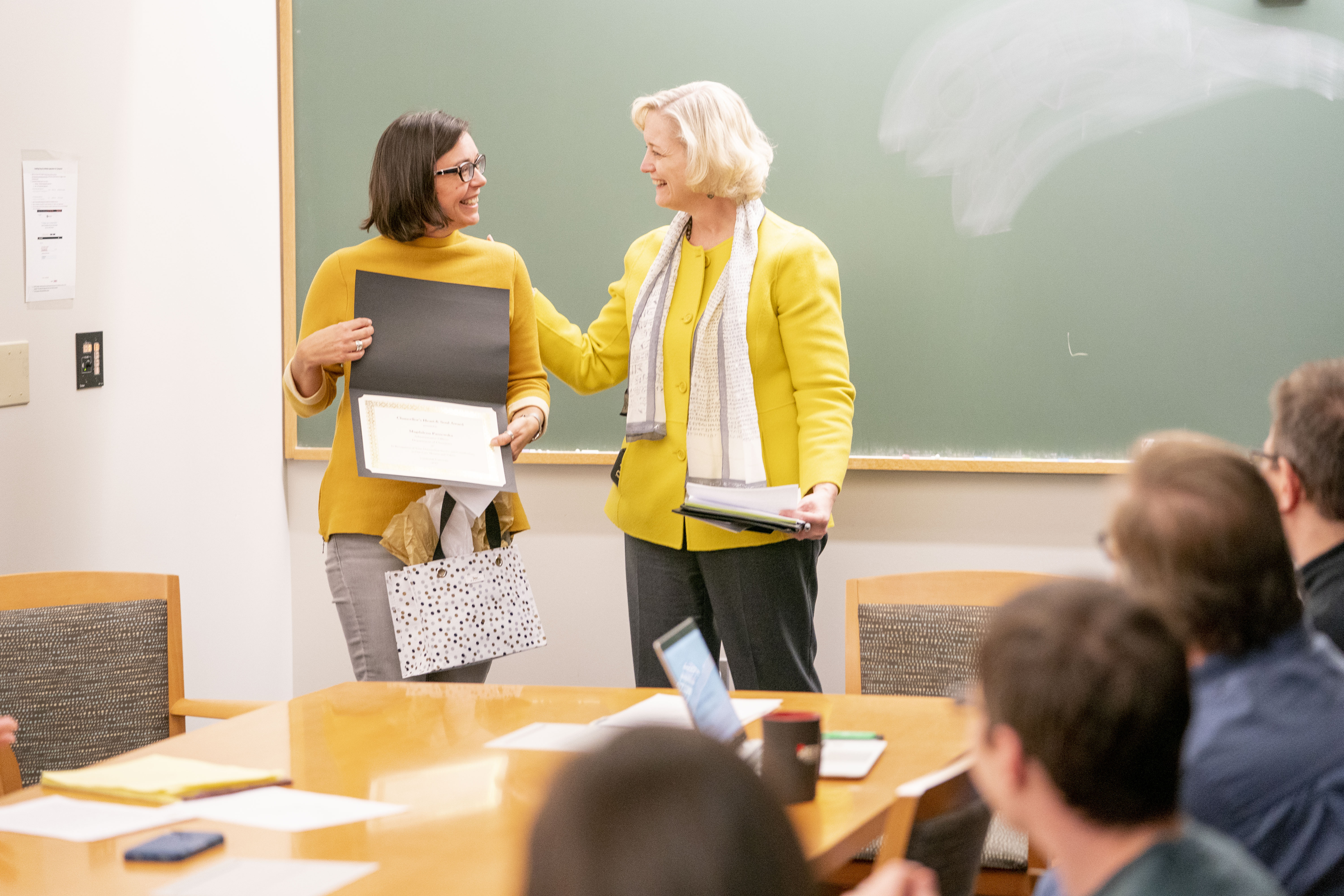 Interim Chancellor and Provost Susan R. Wente presenting the Heart and Soul Award to Magdalena Paszewska on Nov. 1 (Joe Howell/Vanderbilt)