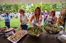 Students and families enjoy delicious food at Family Weekend's Fall for the Arts on the Peabody Esplanade.
