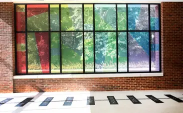 In the new worship space, tall colorful glass windows face southward offering views of the stained glass of Benton Chapel. (Anne Rayner/Vanderbilt)