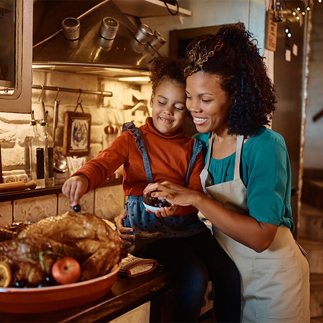 Mom and daughter with turkey
