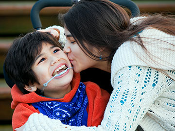 mother kissing her son