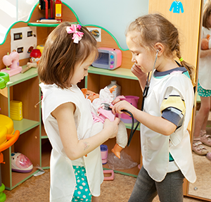 two girls with a doll