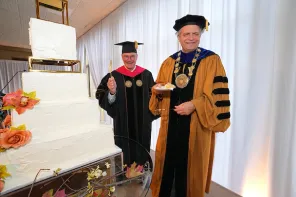 Vanderbilt Board of Trust Chairman Bruce Evans and Chancellor Daniel Diermeier enjoyed cake as part of the Sesquicentennial kickoff celebration on March 25. (Harrison McClary/Vanderbilt)