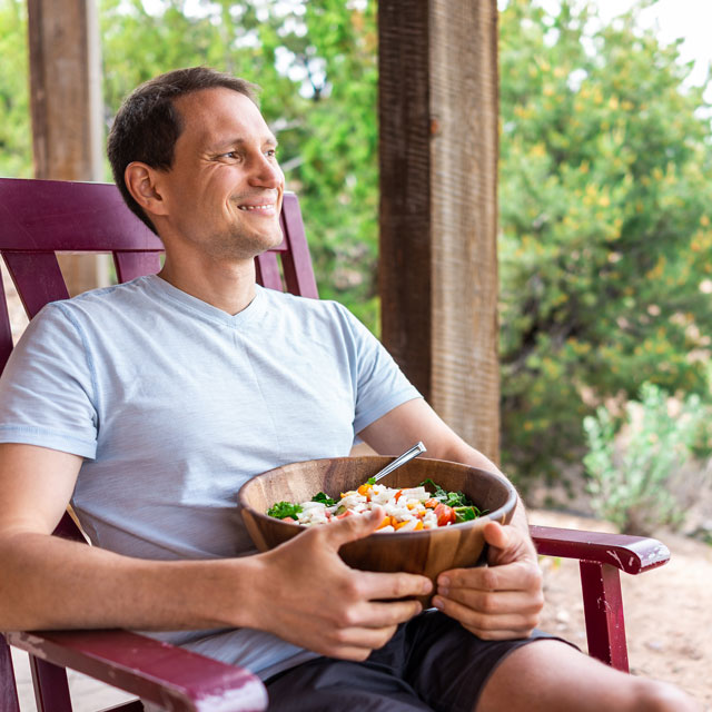 Man enjoying a healthy lunch break and sitting outside.