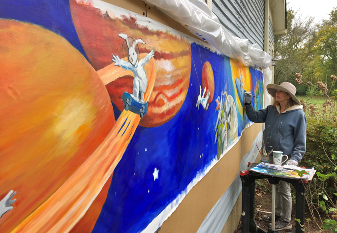 McCampbell works on the 22-foot long mural at her home in Franklin, Tennessee.