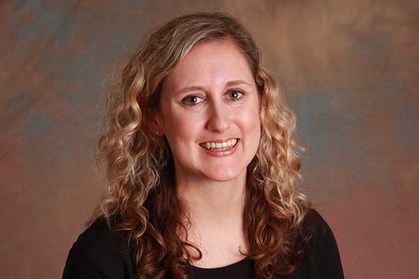 Photo of Megan Simmons smiling at the camera