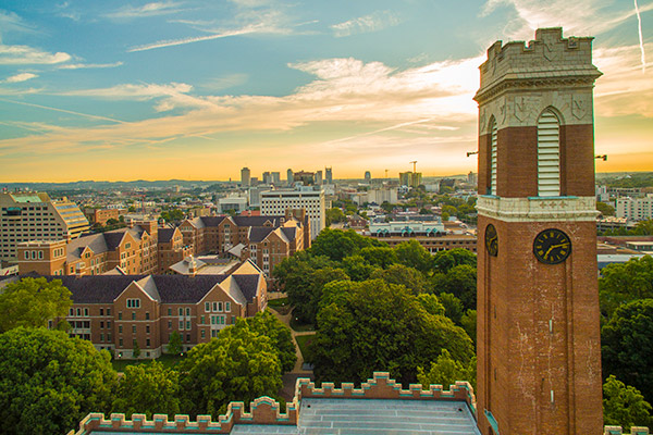The clock tower in Vanderbilt's Kirkland Hall, with the rest of the campus beyond it