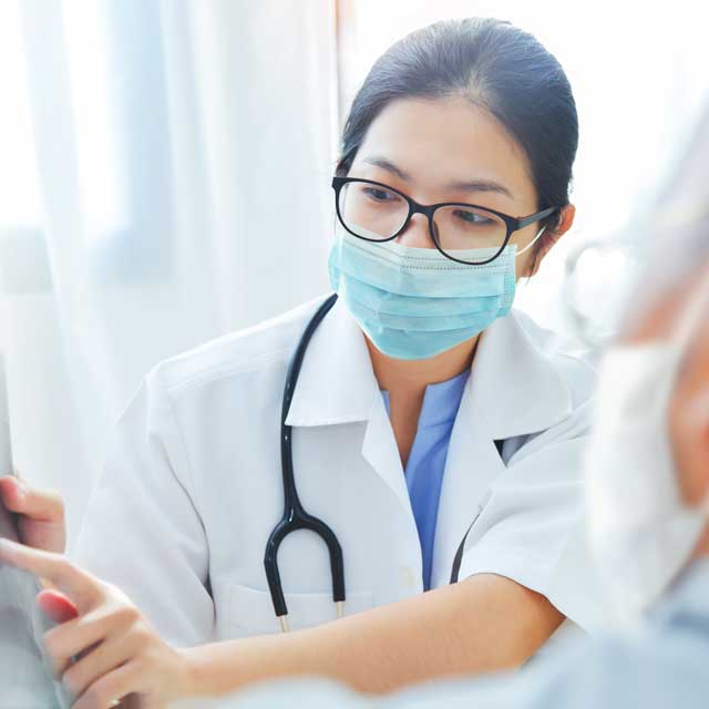 female doctor consulting with another doctor