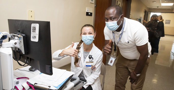 Michael Harris works with Katherine Gilliland, FNP, during the recent transition of clinical and IT systems at Vanderbilt Tullahoma-Harton Hospital.