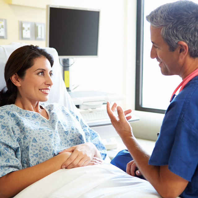 A patient speaking to her doctor about her inflammatory bowel disease.