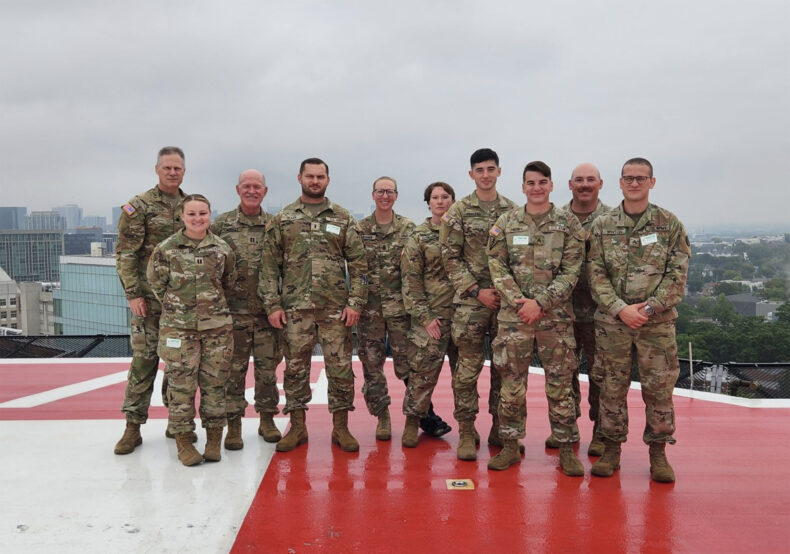 Participants from the Tennessee National Guard pose for a photo on the Vanderbilt LifeFlight helipad.