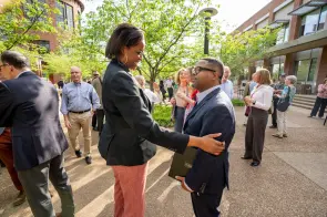Candice Lee and H. Richard Milner chat at the Spring Faculty Assembly reception.