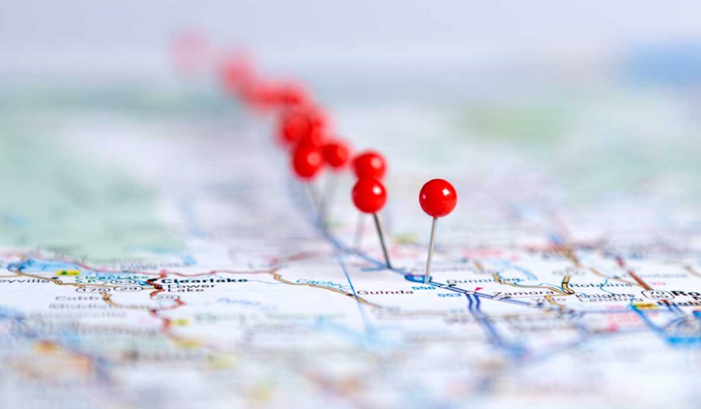 Thumbtacks on a map