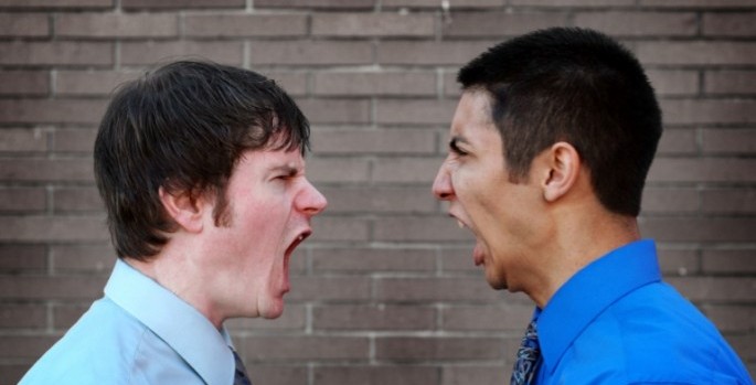 two men shouting at each other
