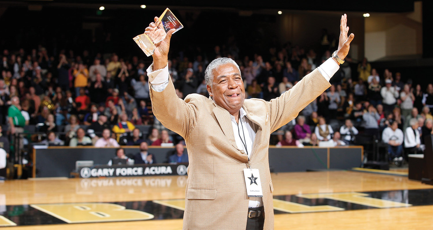 Godfrey Dillard, who played for the Commodore basketball team in 1966–67, grasps his Perry Wallace Courage Award, presented in Memorial Gym Feb. 18 as part of Equality Weekend. Wallace and Dillard broke the SEC color barrier 50 years ago. (JOE HOWELL)