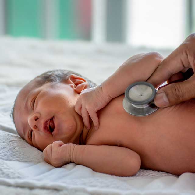 Baby being examined by doctor