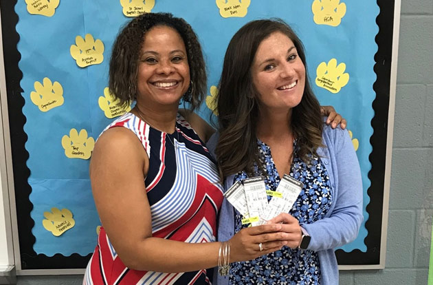 Myra Taylor, principal, and Megan McGuire, Community Achieves site coordinator, at Buena Vista Elementary School, receive tickets to the Beyonce-Jay-Z concert at Vanderbilt Stadium on Aug. 23. (Vanderbilt University)