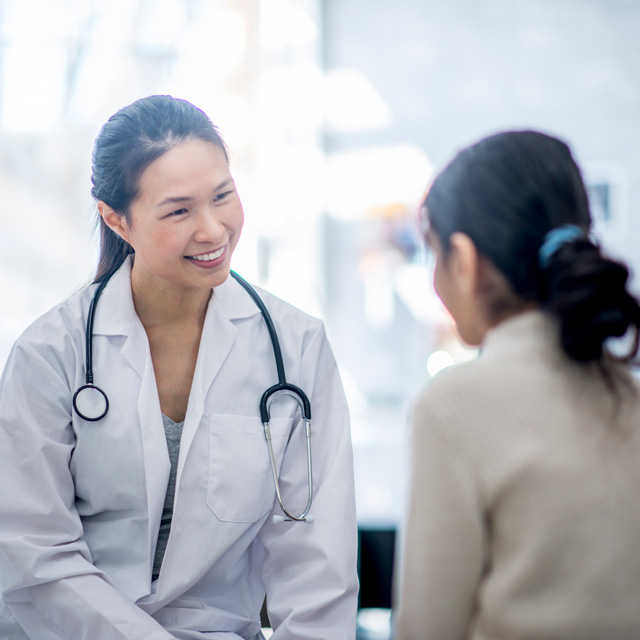 Doctor speaking with patient and giving good news
