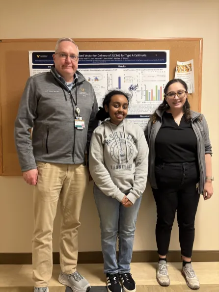 Lena Zewdu Feleke with Dr. Matthew Wilson (left) and Jennifer Peek (right)