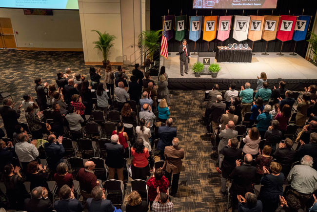 Faculty applaud Chancellor Nicholas S. Zeppos at the spring assembly April 4. (Joe Howell/Vanderbilt)