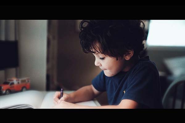 Little boy drawing a picture