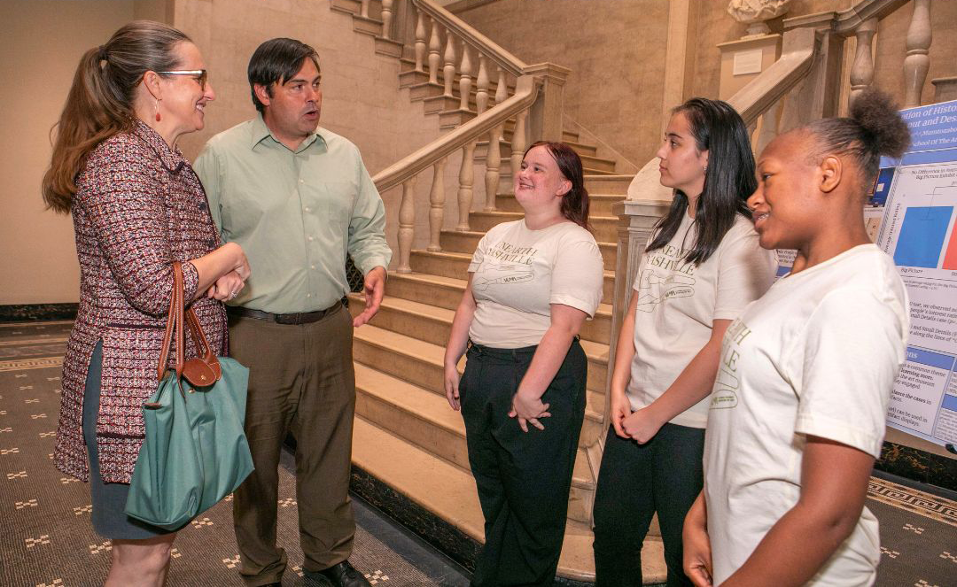 Nashville Vice Mayor Angie Henderson explored the “Unearthing Nashville” exhibit alongside Professor Adam Fracchia of the Metropolitan Historical Commission and students from the School for Science and Math at Vanderbilt. (Photo courtesy of Peabody College)