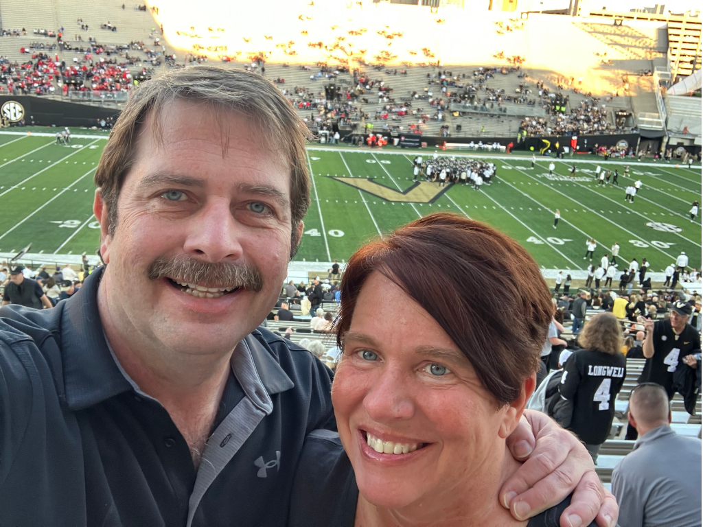 David Baughman and his wife at a Vanderbilt football game.