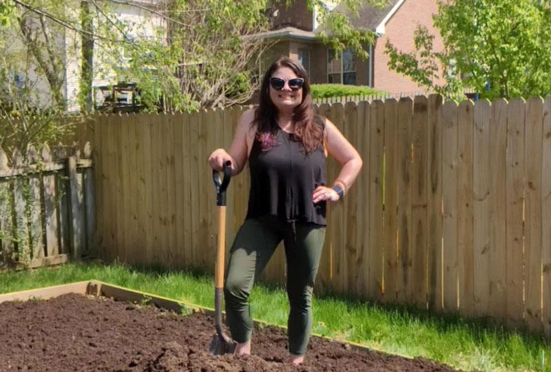 Portrait of author Heather Duggin in her garden.