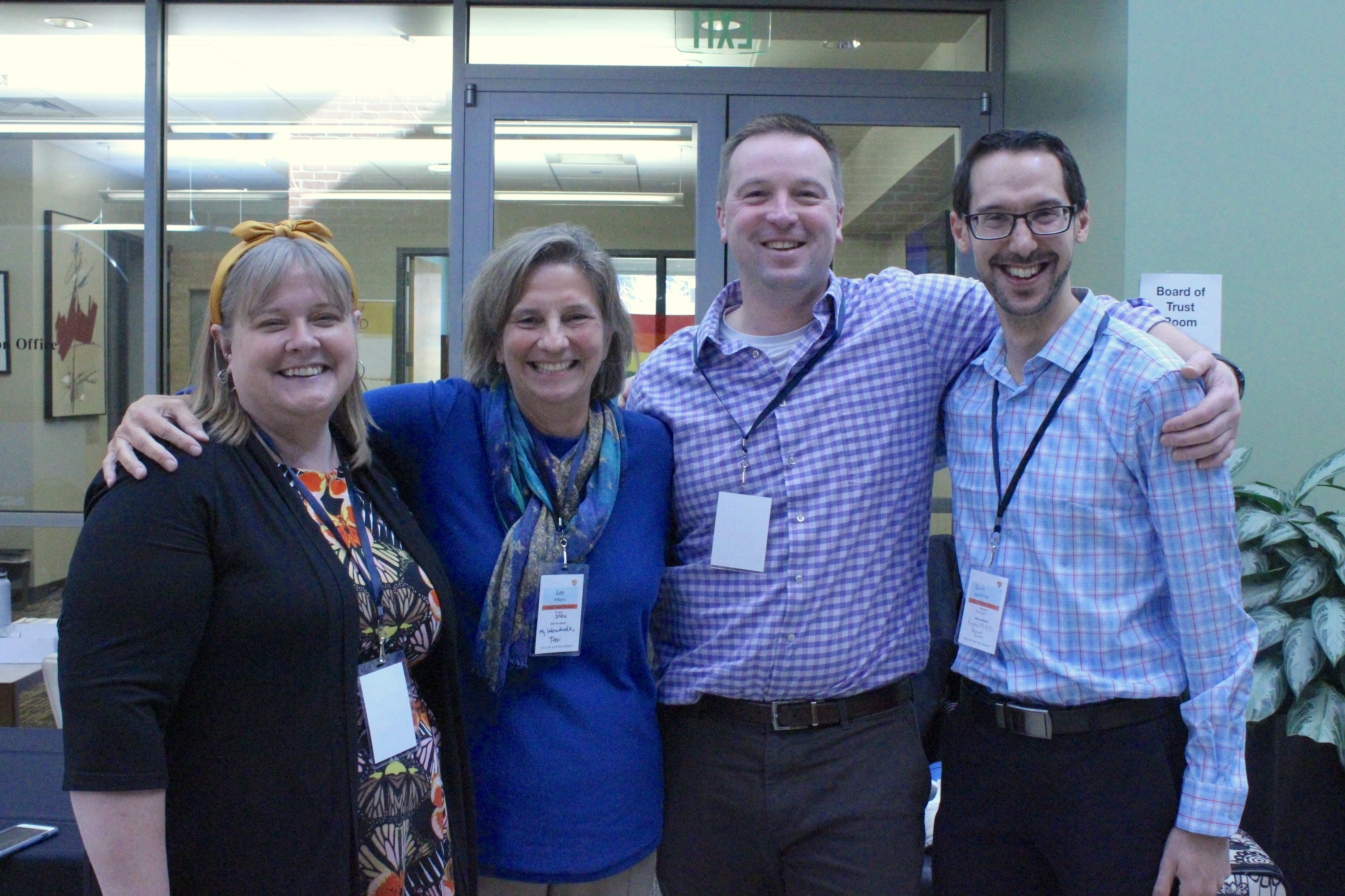 College Autism Summit 2022 planning committee share a laugh during the conference.