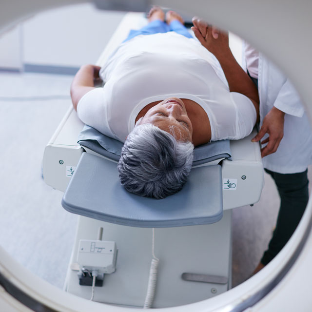 Patient entering a CT scan for lung screening.