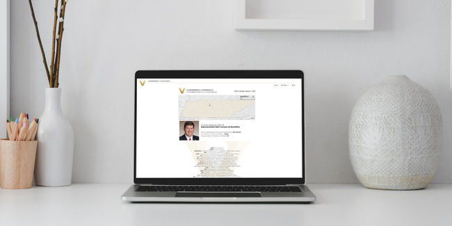 image of District Impact Report shown on laptop screen