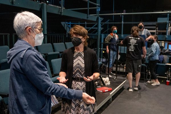 Leah Lowe and Denice Hicks chat inside Neely Auditorium