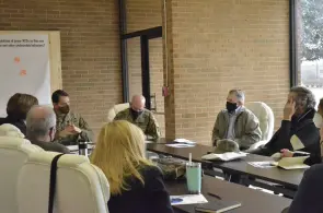 Colonel Andrew Q. Jordan, Fort Campbell garrison commander, discusses ways to engage with soldiers transitioning from the Army into the civilian workforce with representatives from Vanderbilt University and Civilian Aides to the Secretary of the Army. (Ethan Steinquest, Fort Campbell Courier)